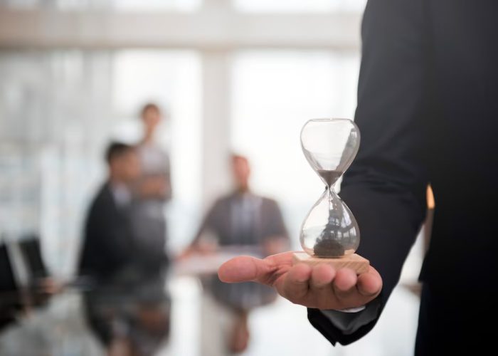 businessman-holding-hour-glass-signifies-importance-being-time_53876-13940